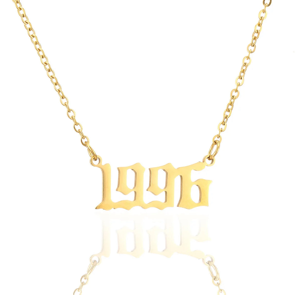 Birth year necklace. ￼￼ Stainless steel, 18 karat gold plated.