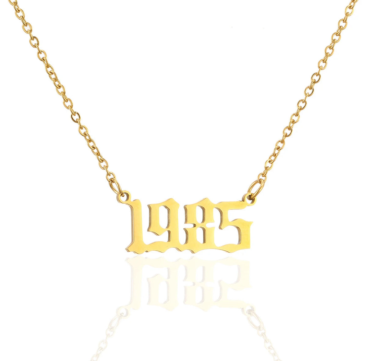 Birth year necklace. ￼￼ Stainless steel, 18 karat gold plated.