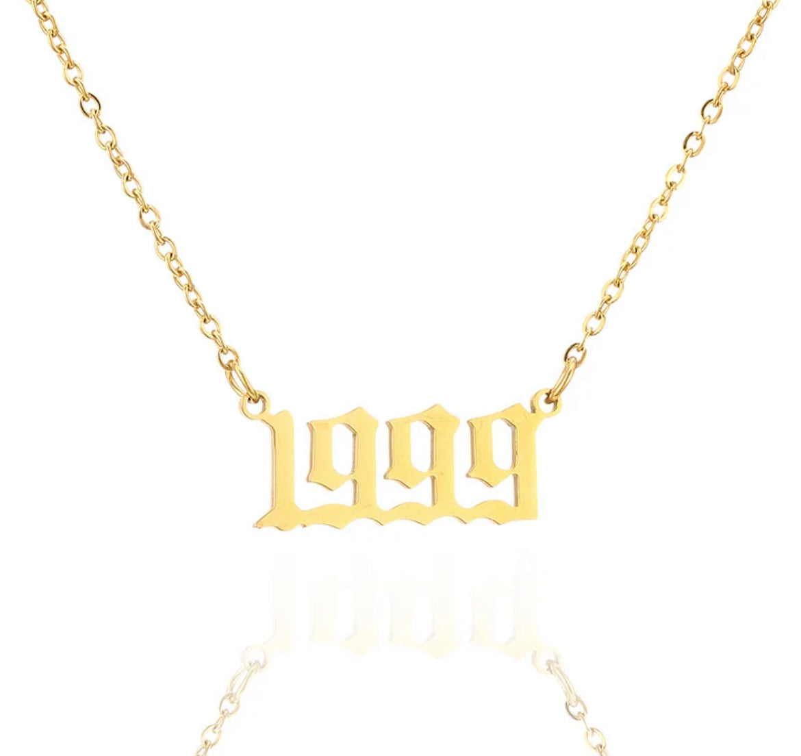 Birth year necklace. ￼￼ Stainless steel, 18 karat gold plated.